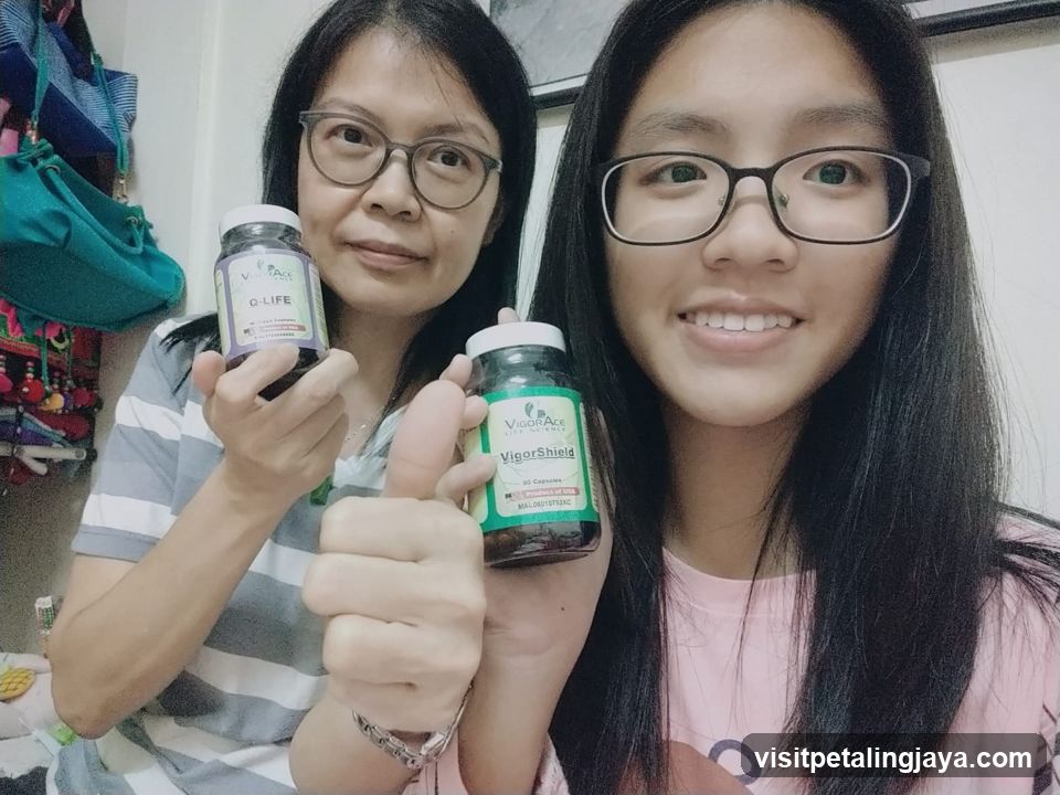 Two women holding supplement bottles
