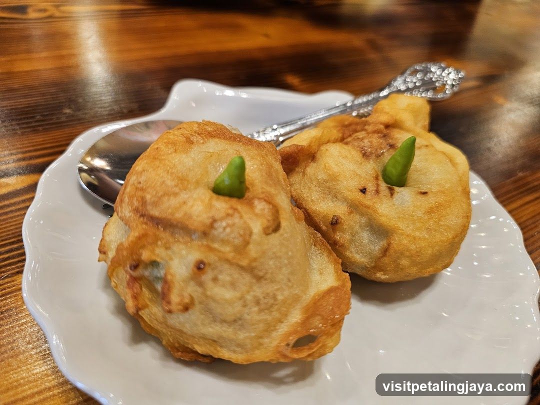 Fried Dumplings with Green Chili Garnish