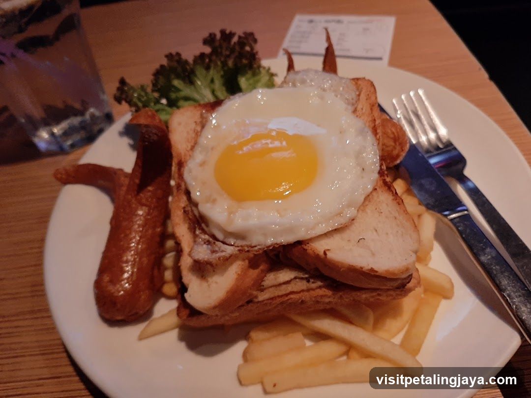 Fried Egg Sandwich with Fries and Sausage