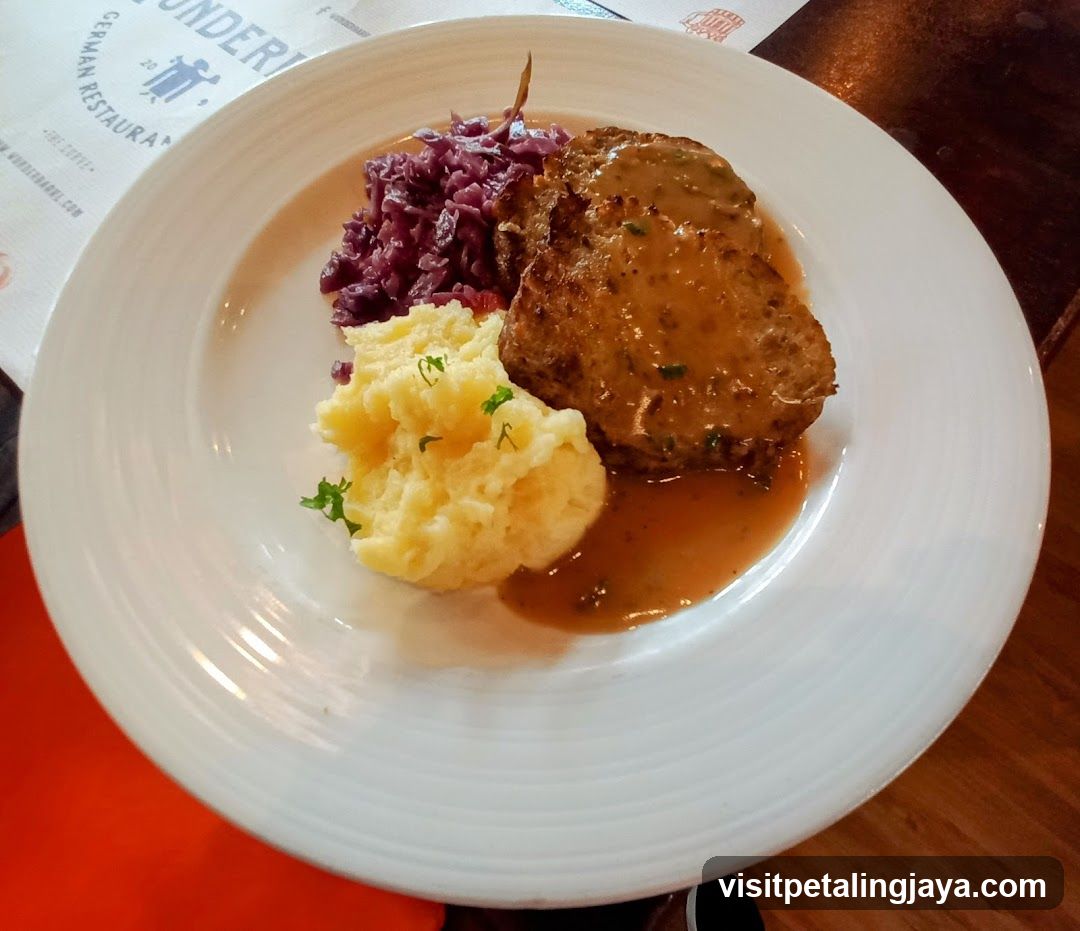 Plate of Meat with Red Cabbage and Mashed Potatoes