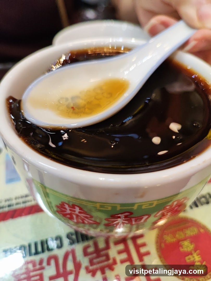 Bowl of dark dessert with spoon