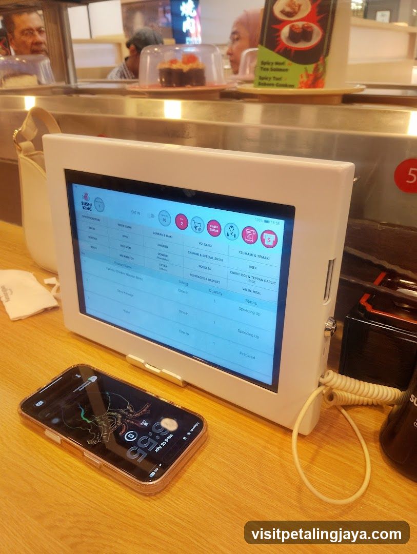 KFC Order Screen and Phone on Counter