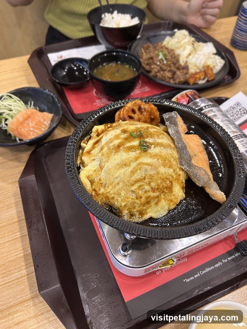 Japanese-style meal with omurice and side dishes