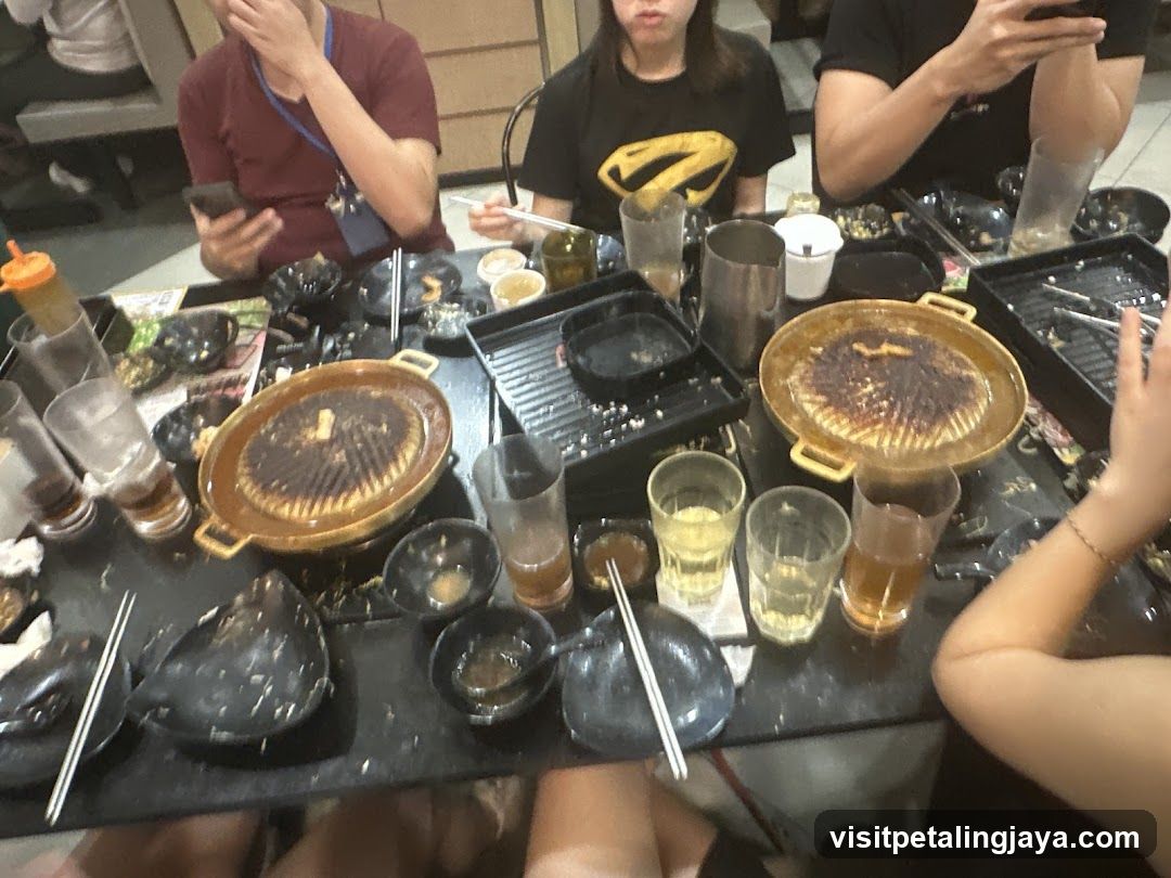 Group eating at Korean BBQ restaurant