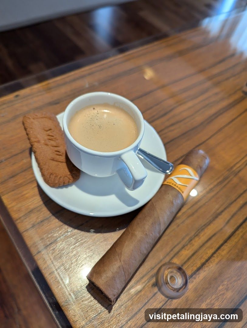 Cup of coffee with biscuit and cigar