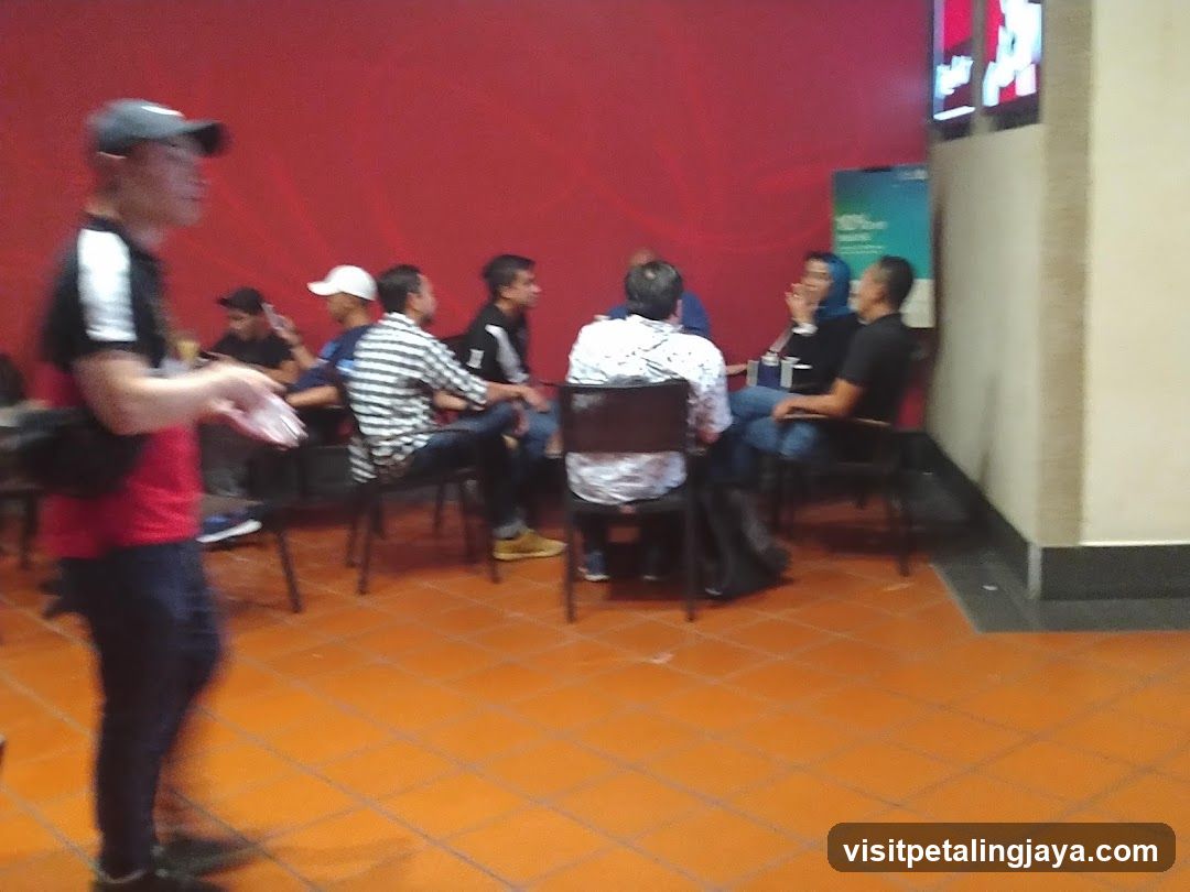 Group of people sitting in a waiting area