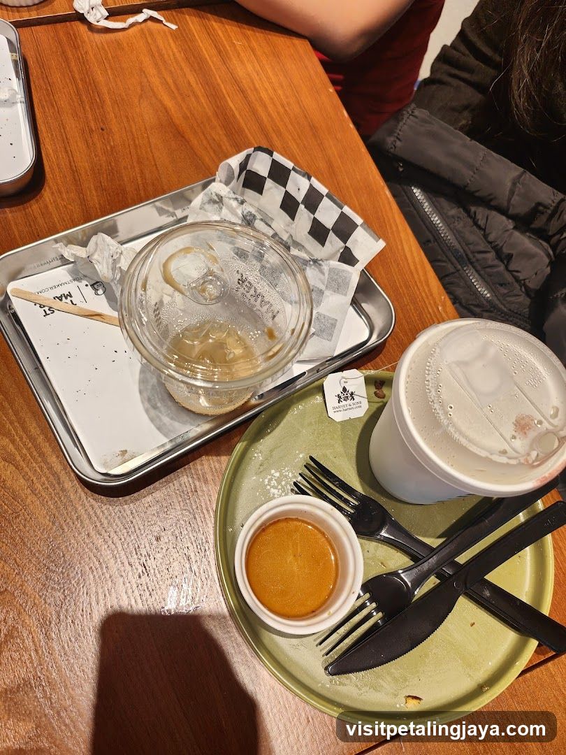 Used food containers and cutlery on table
