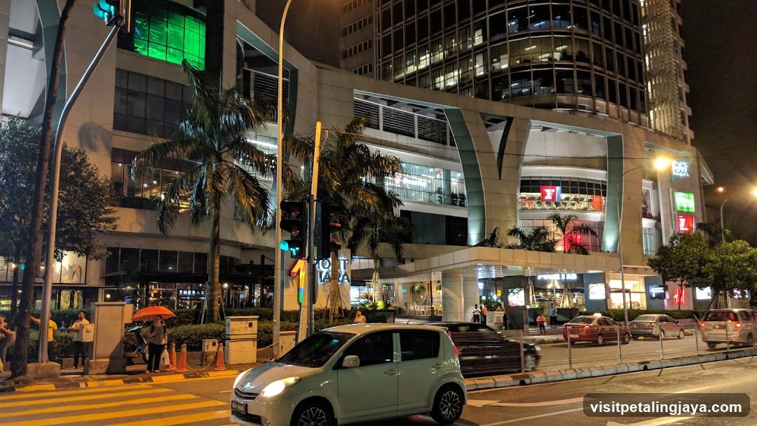 Night City Street Scene with Mall Entrance