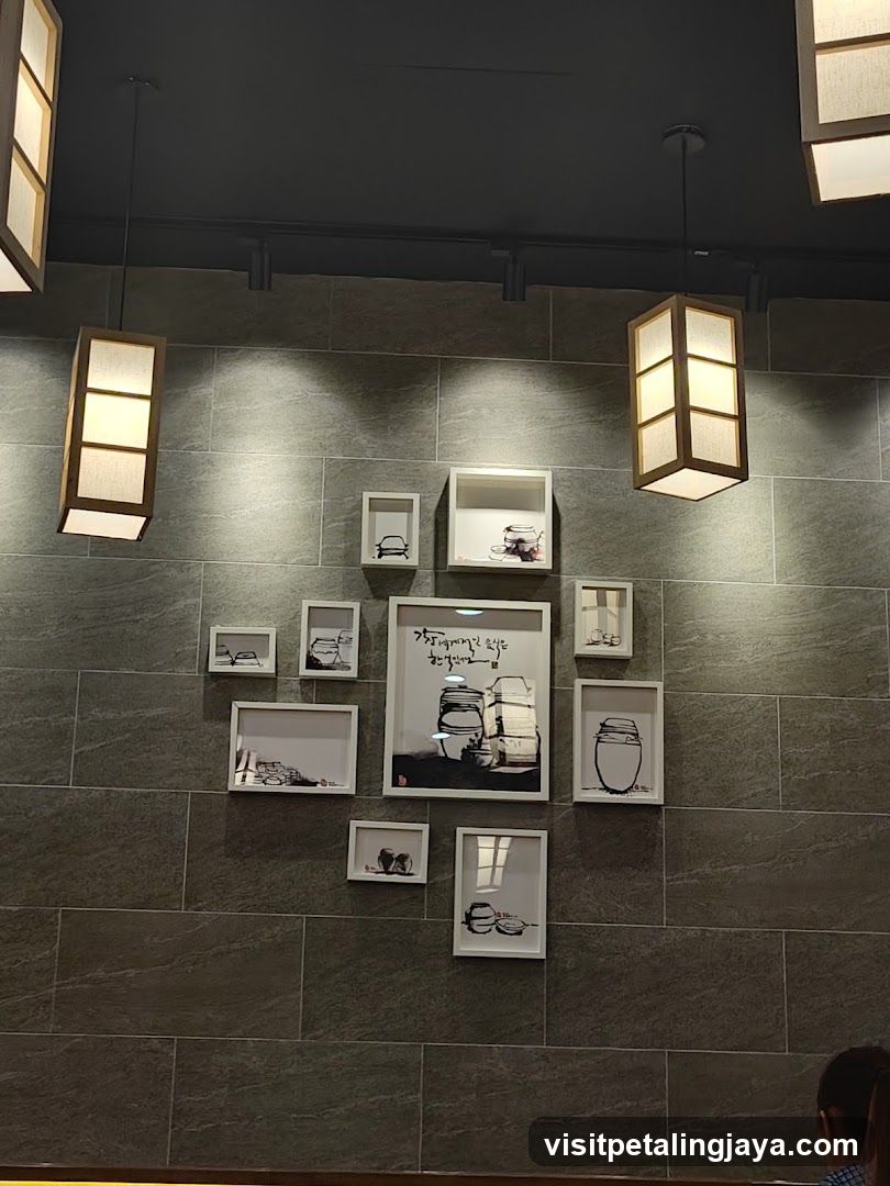 Interior Wall Display with Framed Artwork and Lighting