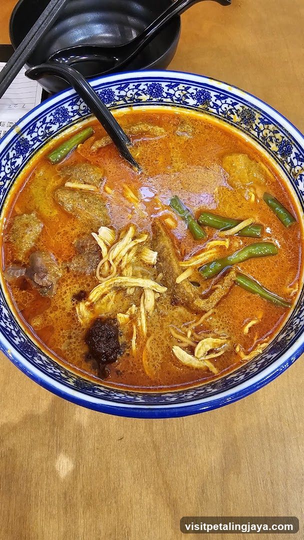 Bowl of Curry with Chicken and Vegetables