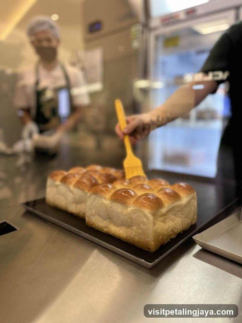 Bread Brushing in Bakery