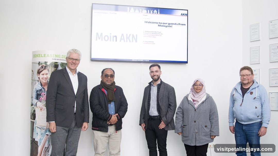 Group photo with presentation screen
