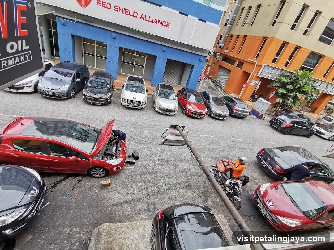 Car Repair Scene with Red Car