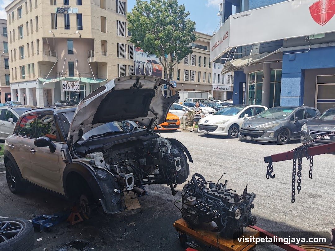 Car Repair Shop Exterior with Engine Removal
