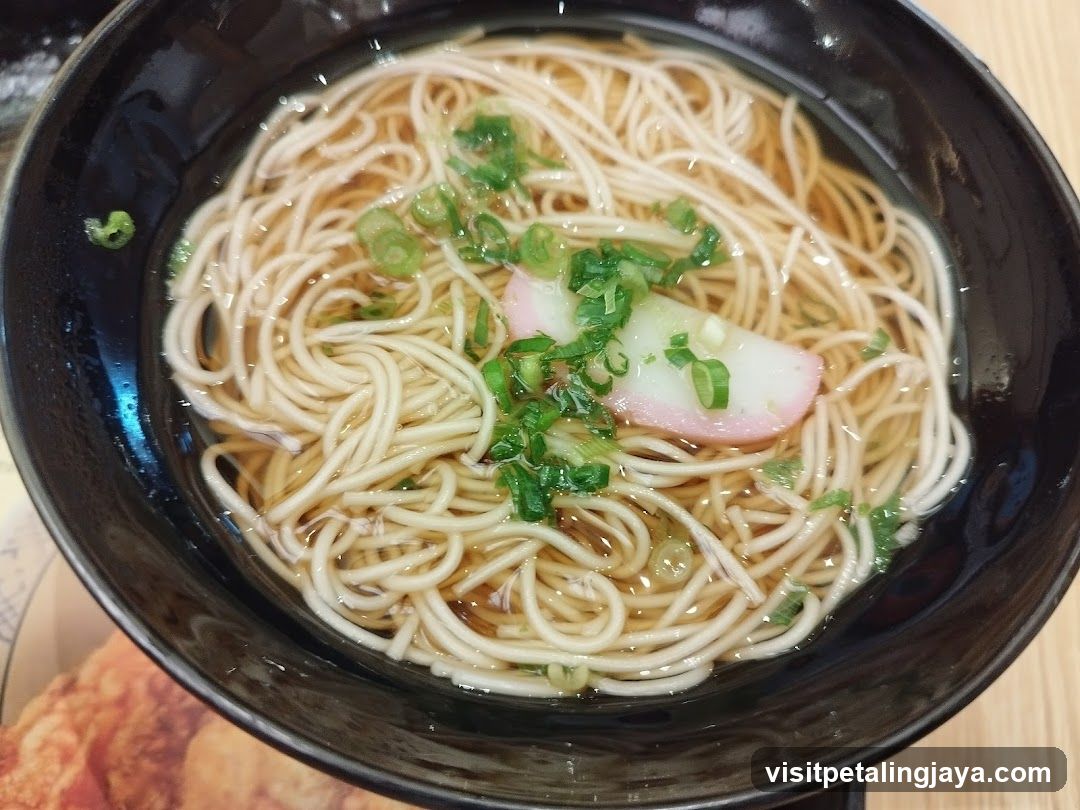 Bowl of Noodles with Green Onions and Fish Cake