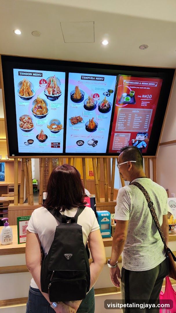 Customers Viewing Menu Board