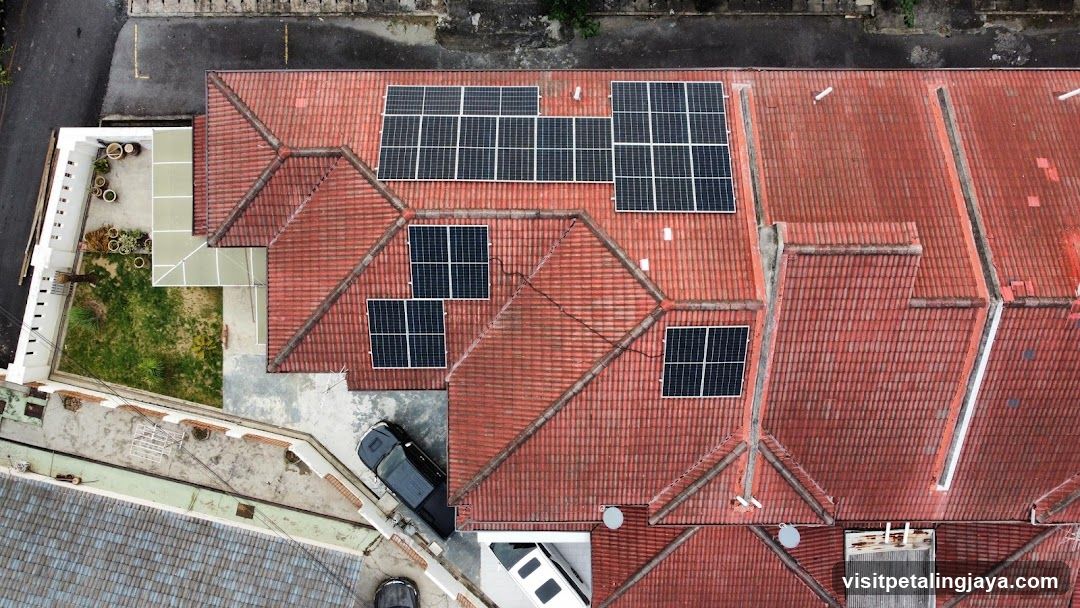 Aerial view of a building with solar panels on the roof