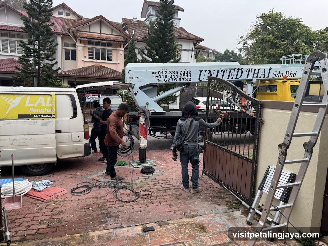 Workmen installing gate system