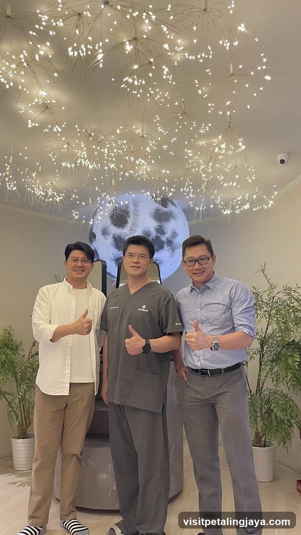 Three men giving thumbs up in a modern interior