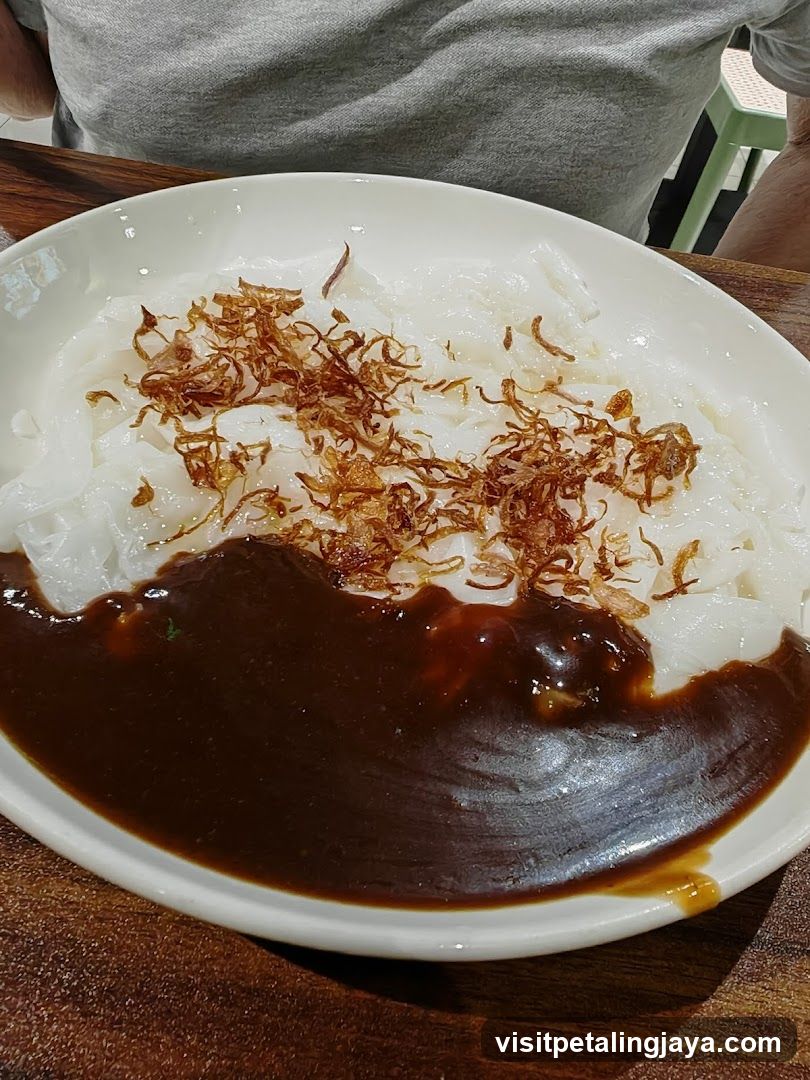 Noodle Dish with Sauce and Crispy Toppings