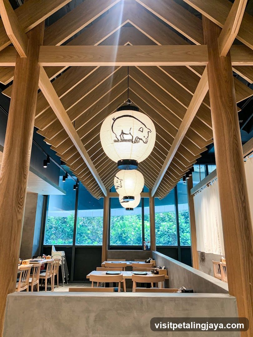 Interior of a wooden restaurant with hanging lanterns