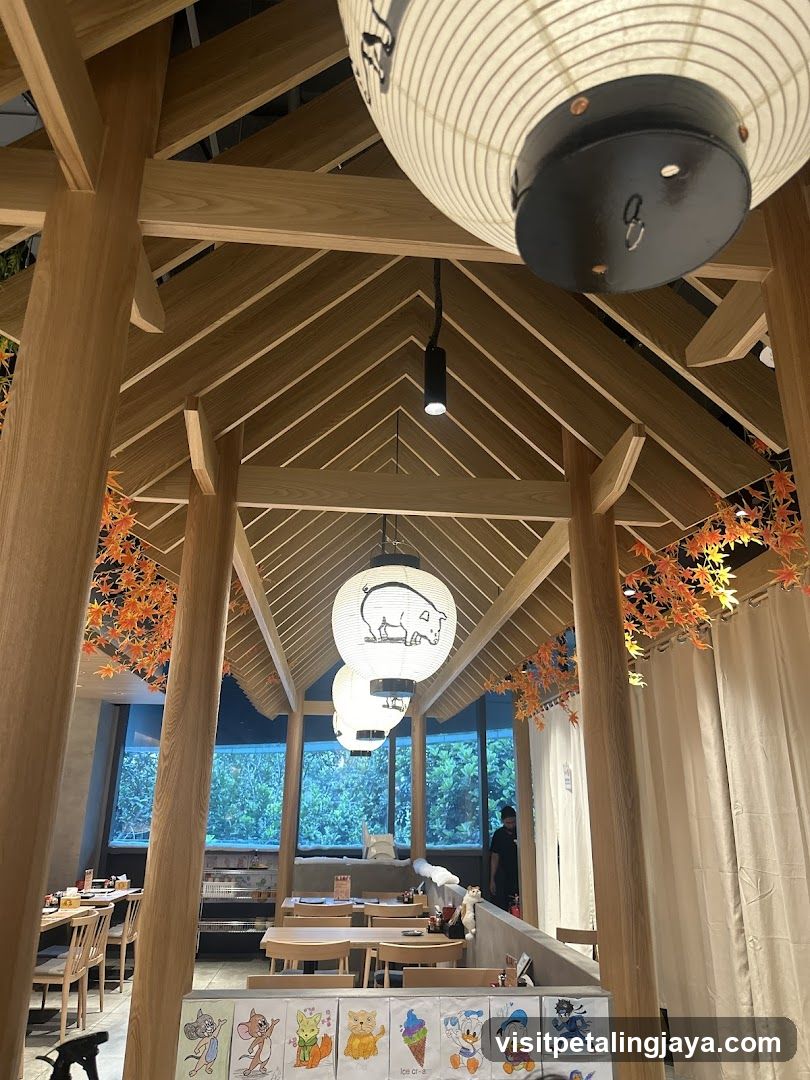 Interior of a Japanese-style restaurant with wooden beams and lanterns