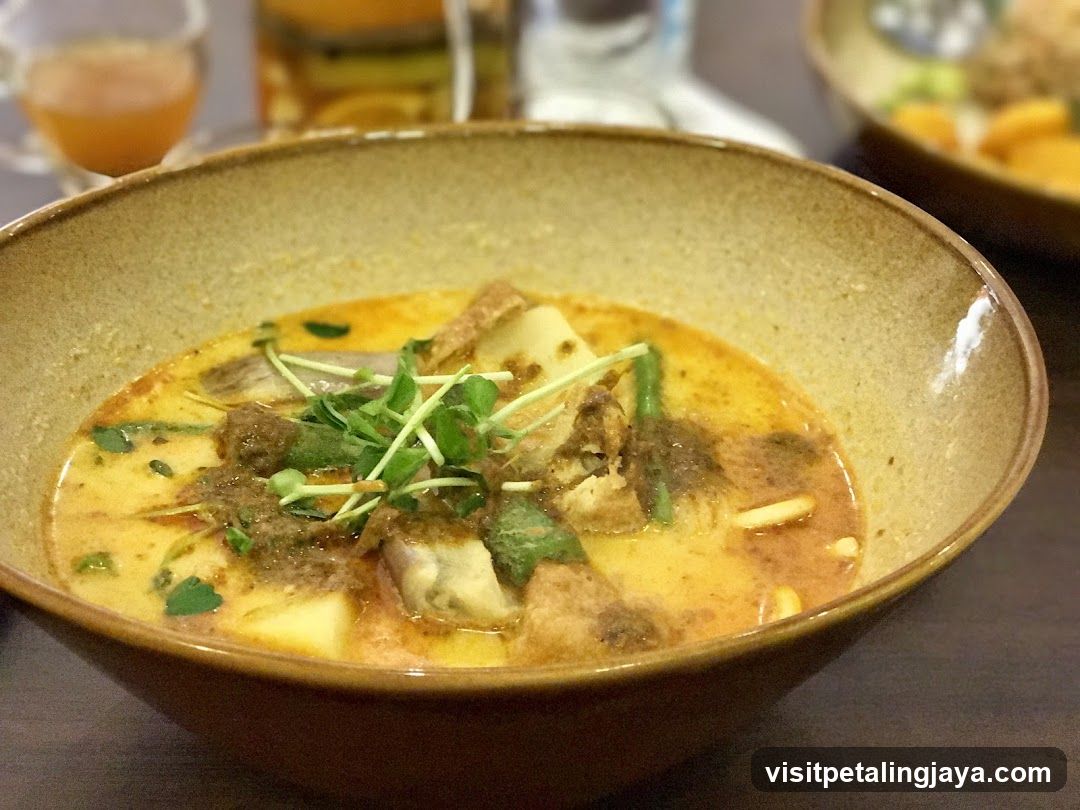 Bowl of Curry Soup with Tofu and Greens