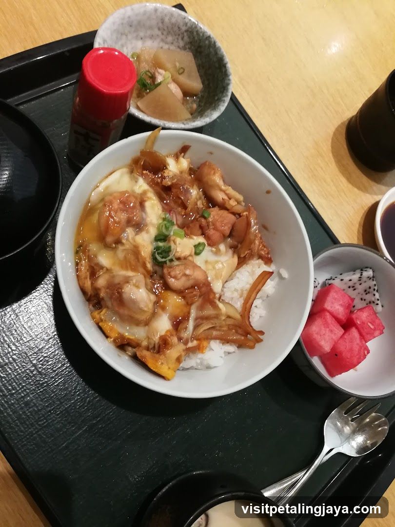 Japanese-style meal with rice bowl and side dishes