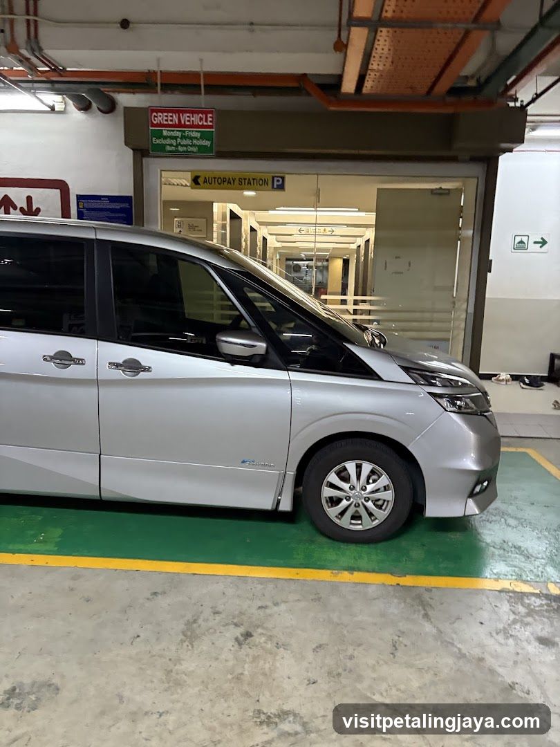 Silver Minivan in Parking Garage