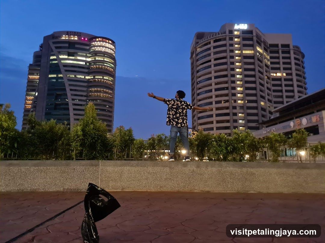 Evening Cityscape with Person on Wall