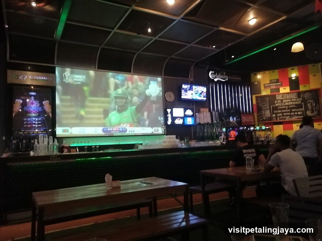 Bar Interior with Cricket Match on Screen
