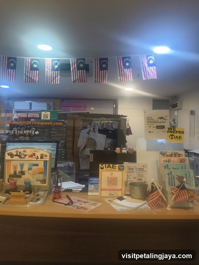 Interior of a shop with Malaysian flags and promotional materials