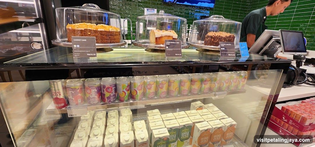 Cafe Display Case with Cakes and Drinks