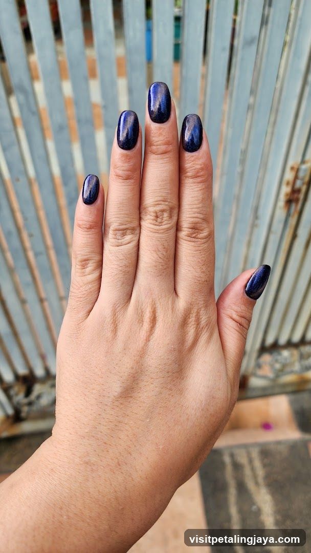 Hand with Dark Blue Nail Polish