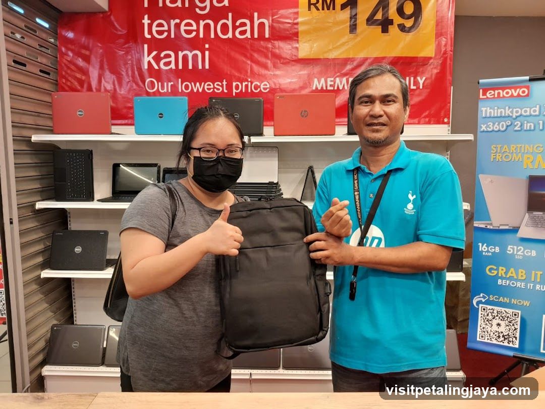 Laptop Store Interior with Staff and Customer