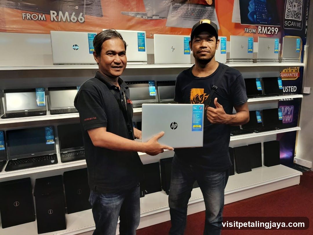 Laptop Store Interior with Staff and Customer
