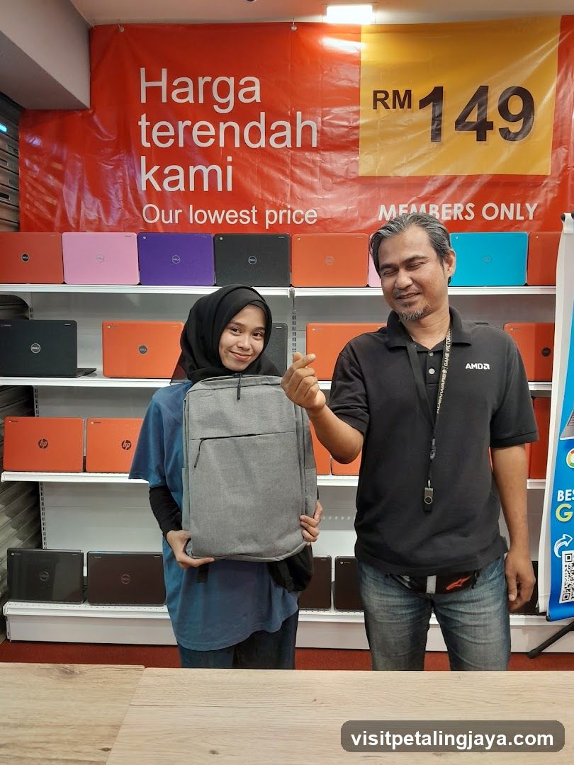 Laptop Store Interior with Staff and Product Display