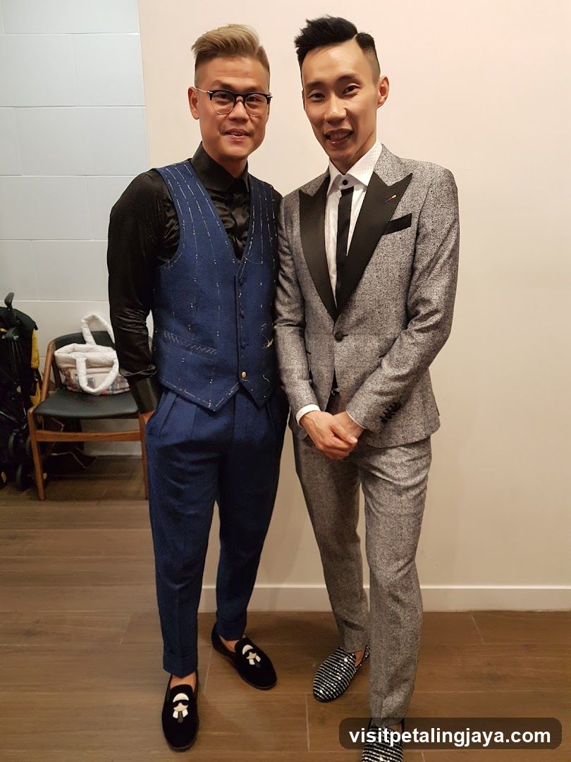 Two men in formal attire posing indoors