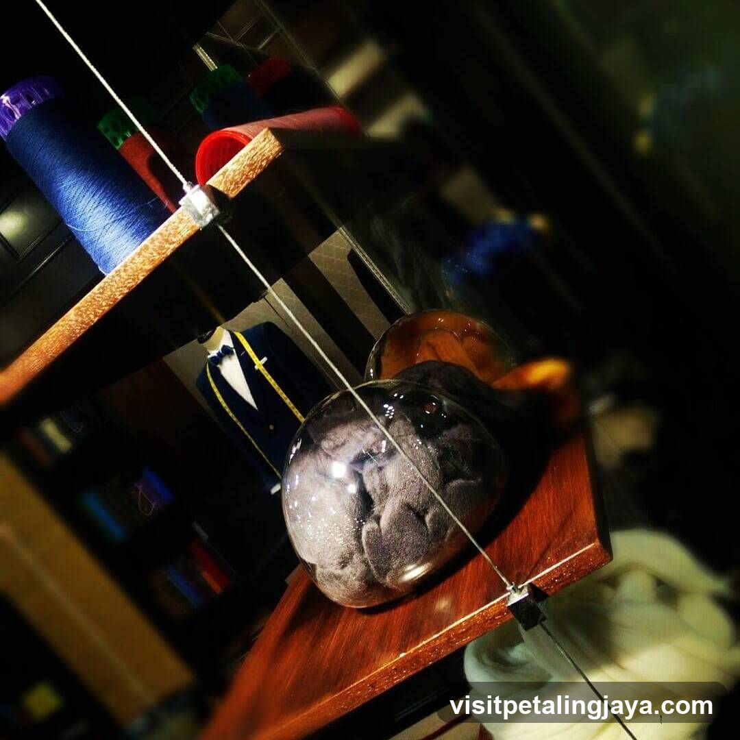 Shelf with Spools and Glass Objects