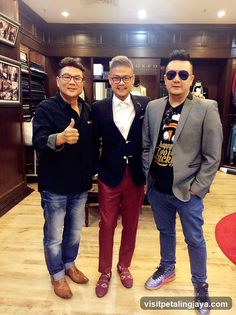 Three men posing in a clothing store interior
