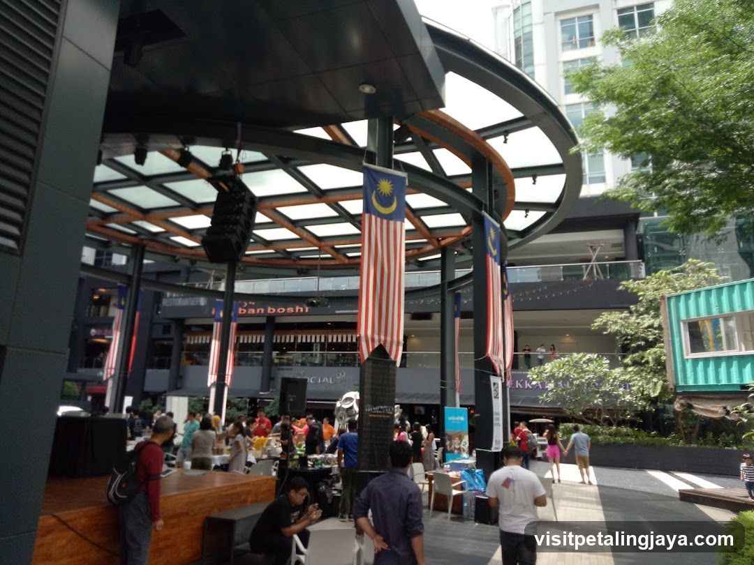 Outdoor Market Scene with Malaysian Flags