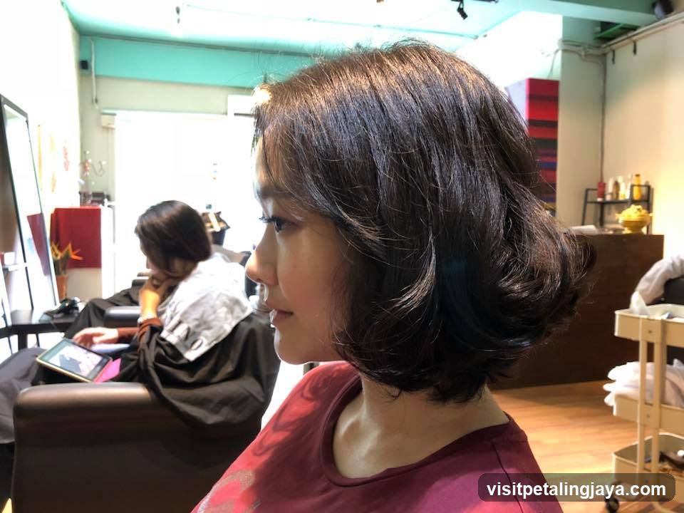Salon Interior with Client and Stylist