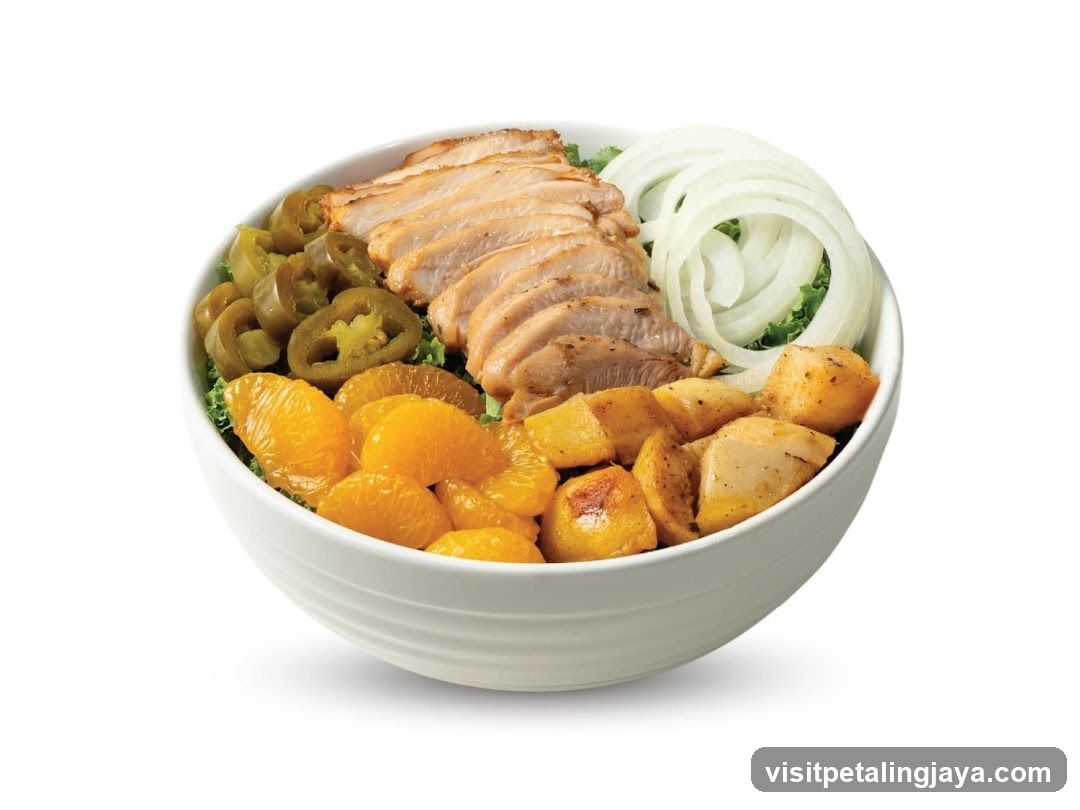 Bowl of Chicken Salad with Fruits and Vegetables