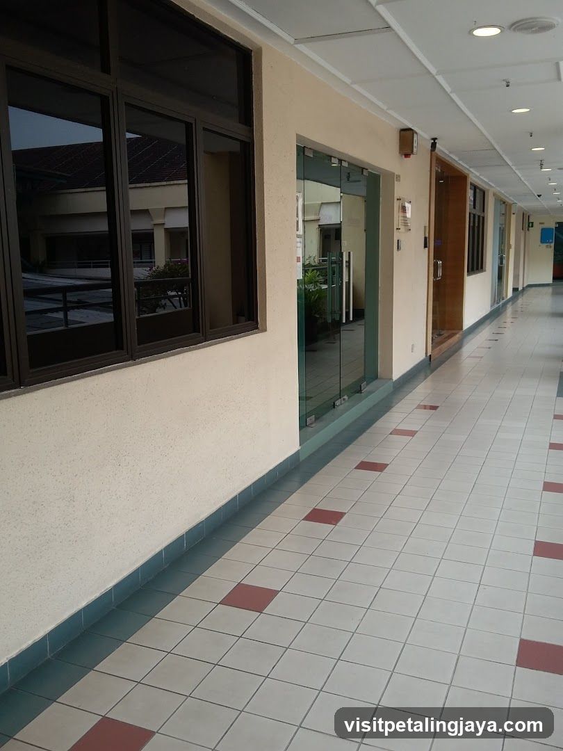 Empty Corridor with Glass Doors and Windows