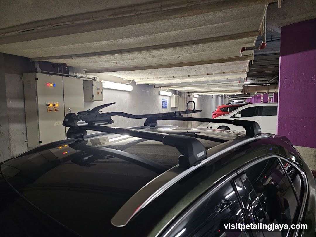Car with roof rack in parking garage