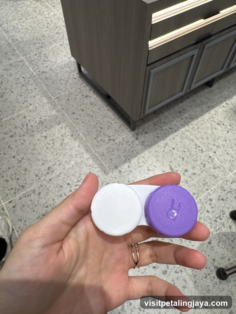Hand holding contact lens case