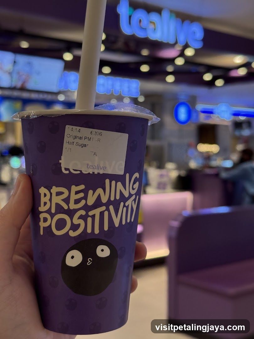 Tealife Beverage Cup Held in Hand