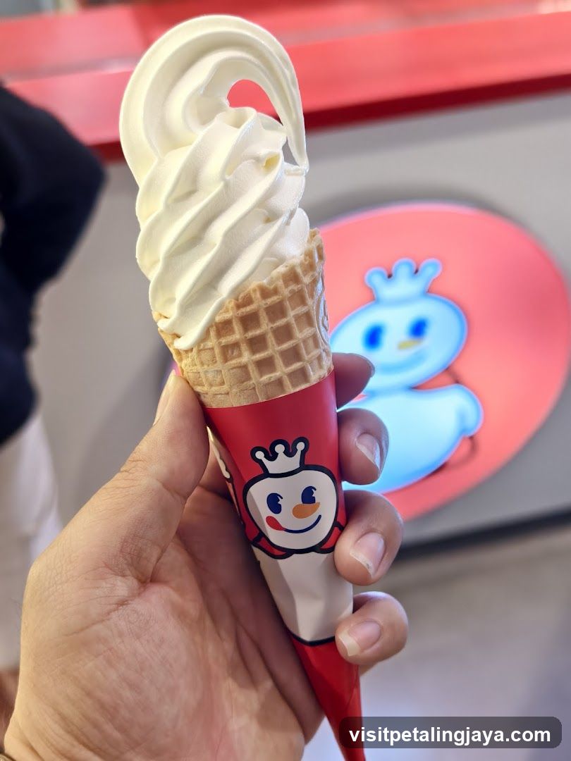Hand holding ice cream cone