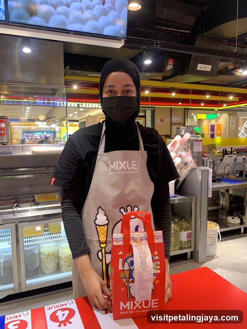 Staff at Mixue Ice Cream & Tea Counter
