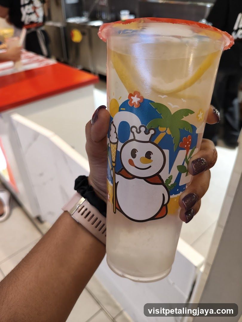 Hand holding a beverage cup
